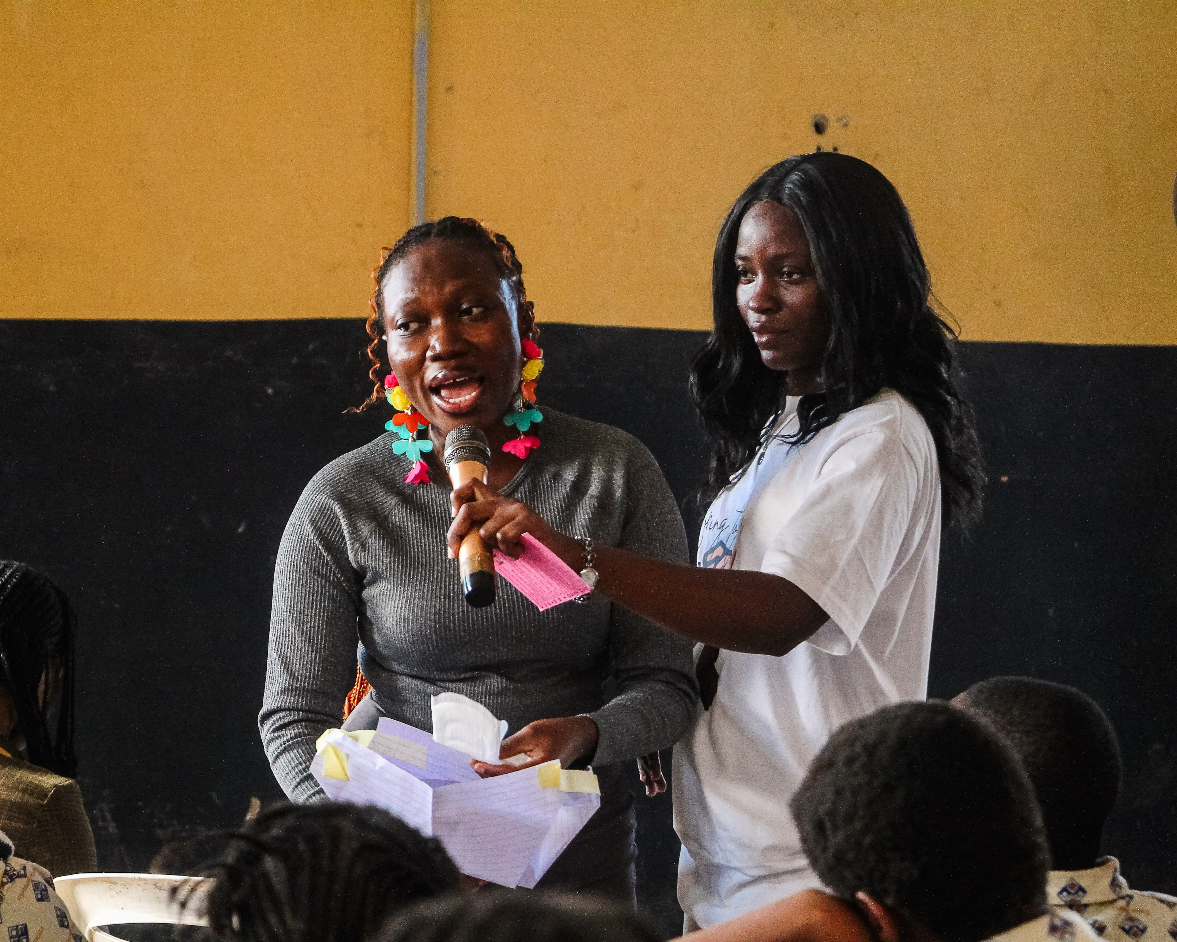 Dr. Odejide Toluwalase and Fakile Modasola addressing the children