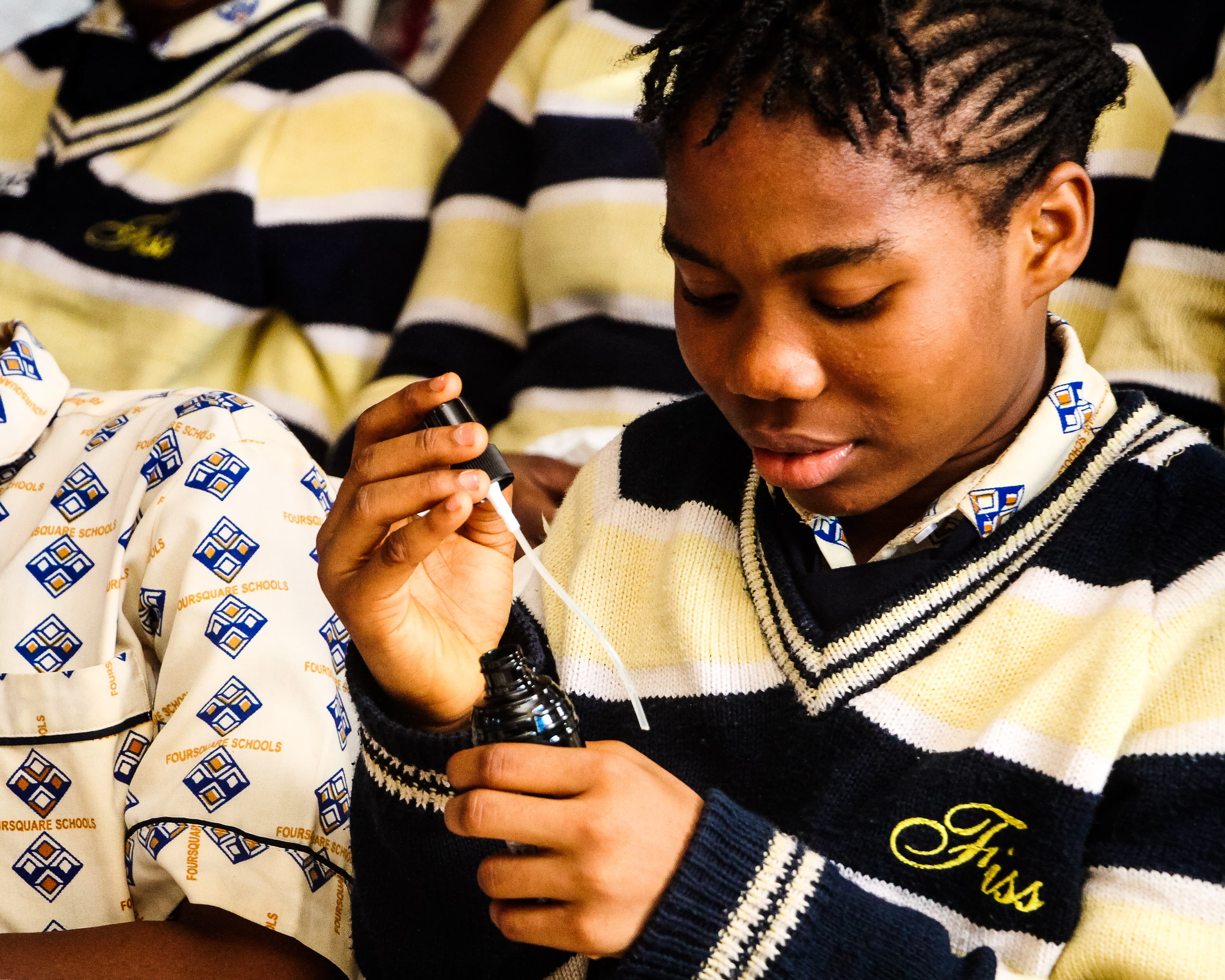 A student smelling the deodorant